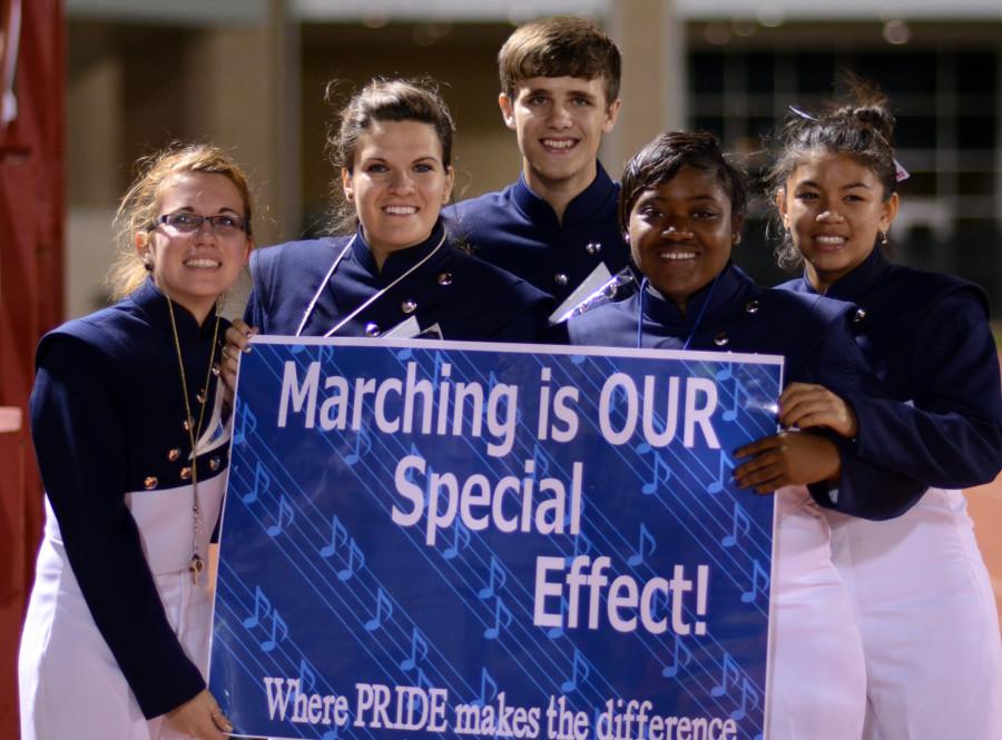 At the final football game of the season, a group of parents made signs for the band.(Olivia Davila photo)