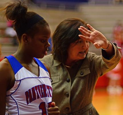 Coach Cathy Self-Morgan demonstrates a play during a timeout in the South Grand Prairie game. (Cody Rogers Photo)