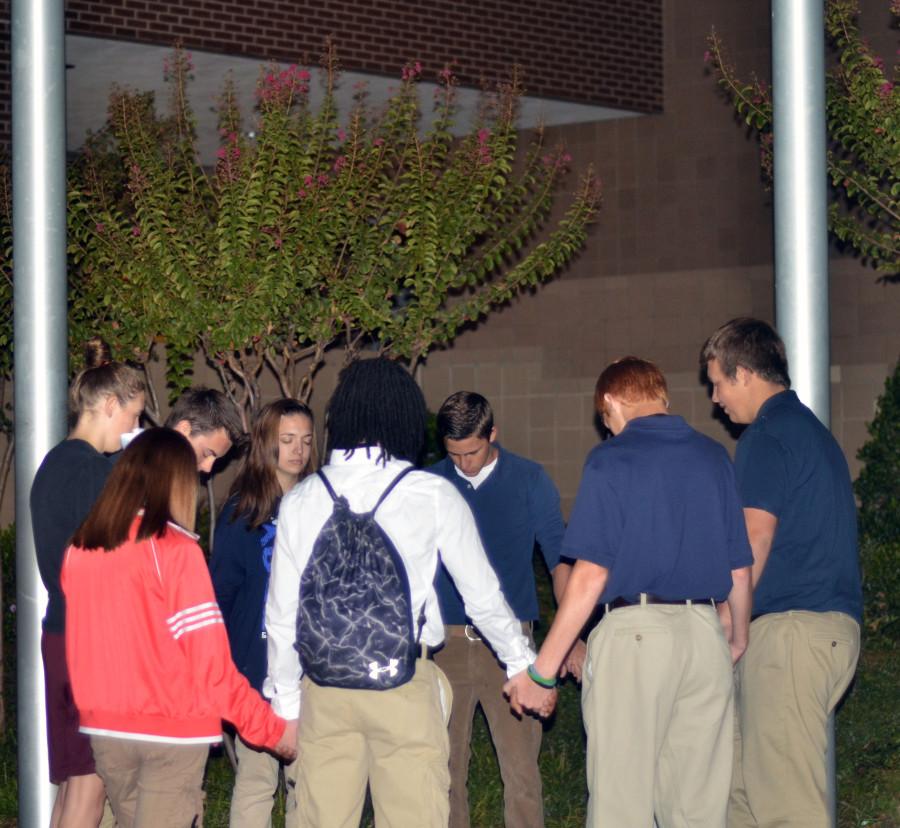 Students+gather+at+the+base+of+the+flagpole+to+pray+together+on+National+See+You+at+The+Pole+Day.+%28Kennedy+Stidham+photo%29