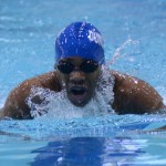 Junior Carlus Brown nears the finish line in his race at the District 7-5A swim meet. The boys finished in 4rth place and sent several swimmers to the Regional meet. (Yonas Nielsen photo)