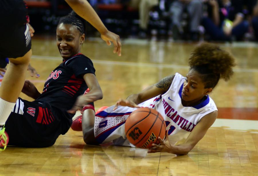 Senior Keyana Smith fights for the ball against a San Antonio Wagner defender under the basket in the Panterettes 80-57 win in the State Semi Finals game. (Leenolia Robinson photo)