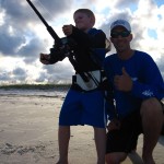 Joseph poses with his son Jackson as he reels in a fish from the shore. (Submitted photo)