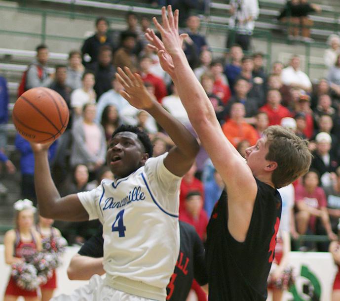 Junior Myles McDougal presses the basket against the Coppell defense during second half action. (Kyhia Jackson photo)