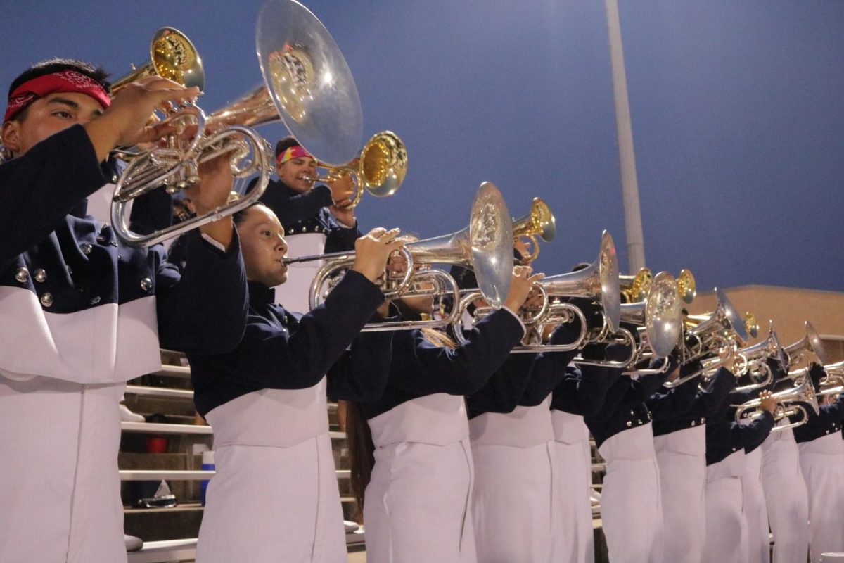 The band plays in the stands at a football game prior to their halftime show. (Gloria Ogunlade photo)