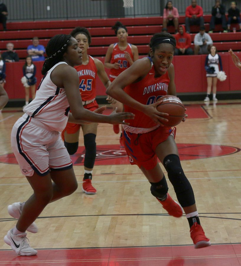 Senior Zarielle Green pushes to the basket for the shot against Allen in the third round of playoffs. (Chana Stanley photo)