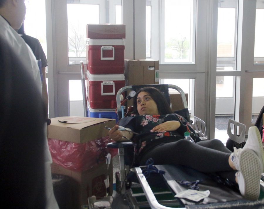 Students give blood during the final blood drive of the school year. (Josefina Soto photo)