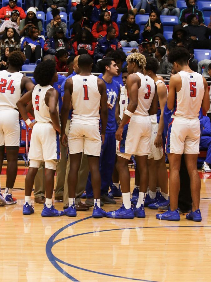 The Duncanville Varsity Basketball team gathers during a timeout. 