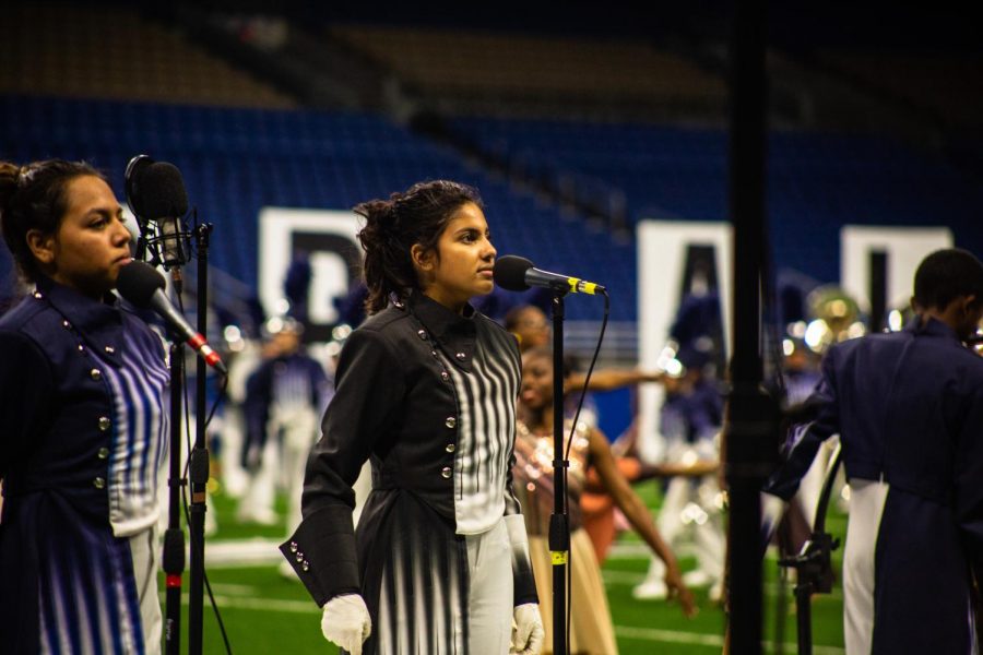 Students perform the pledge during the bands performance at the UIL State Championship.