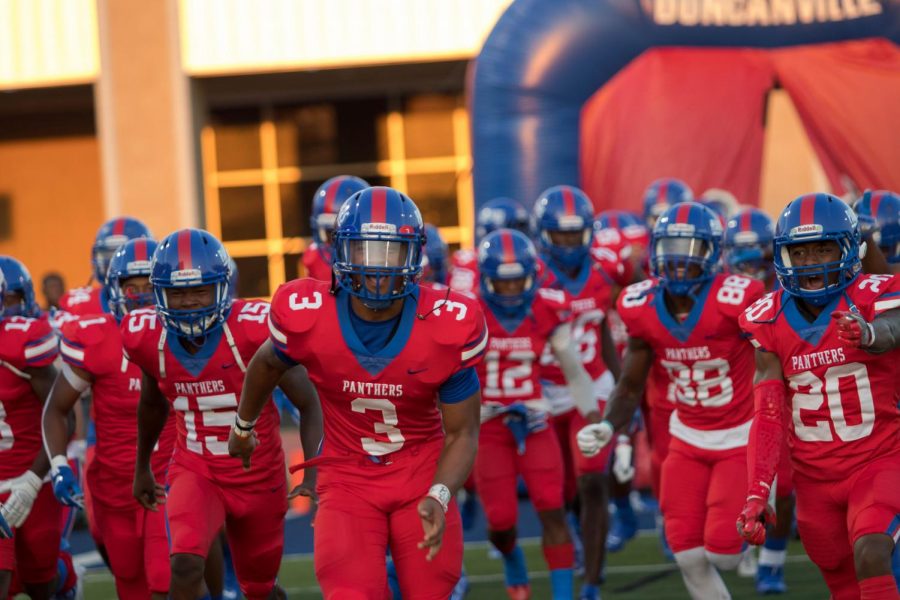 The Duncanville players take the field.