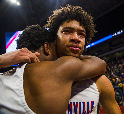 Senior Miles Bennett embraces Christian Mithcell after winning the state championship.