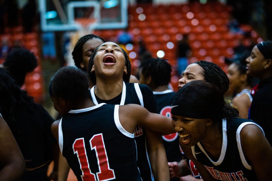 The Pantherettes celebrate after their big win against Desoto in Round 3.