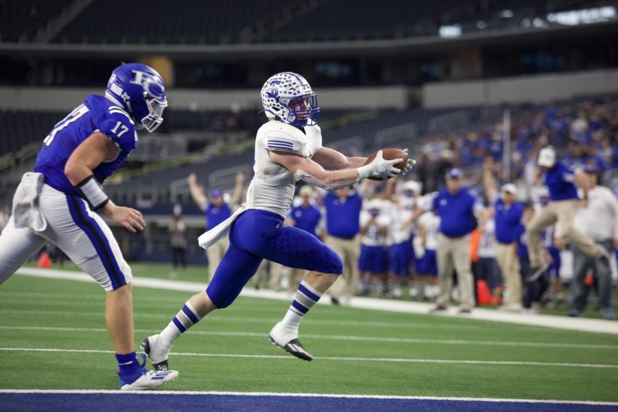 Cody Rinne (3) scampers across line for a touchdown at ATT Stadium during the UIL 2A Championship in Arlington, TX.